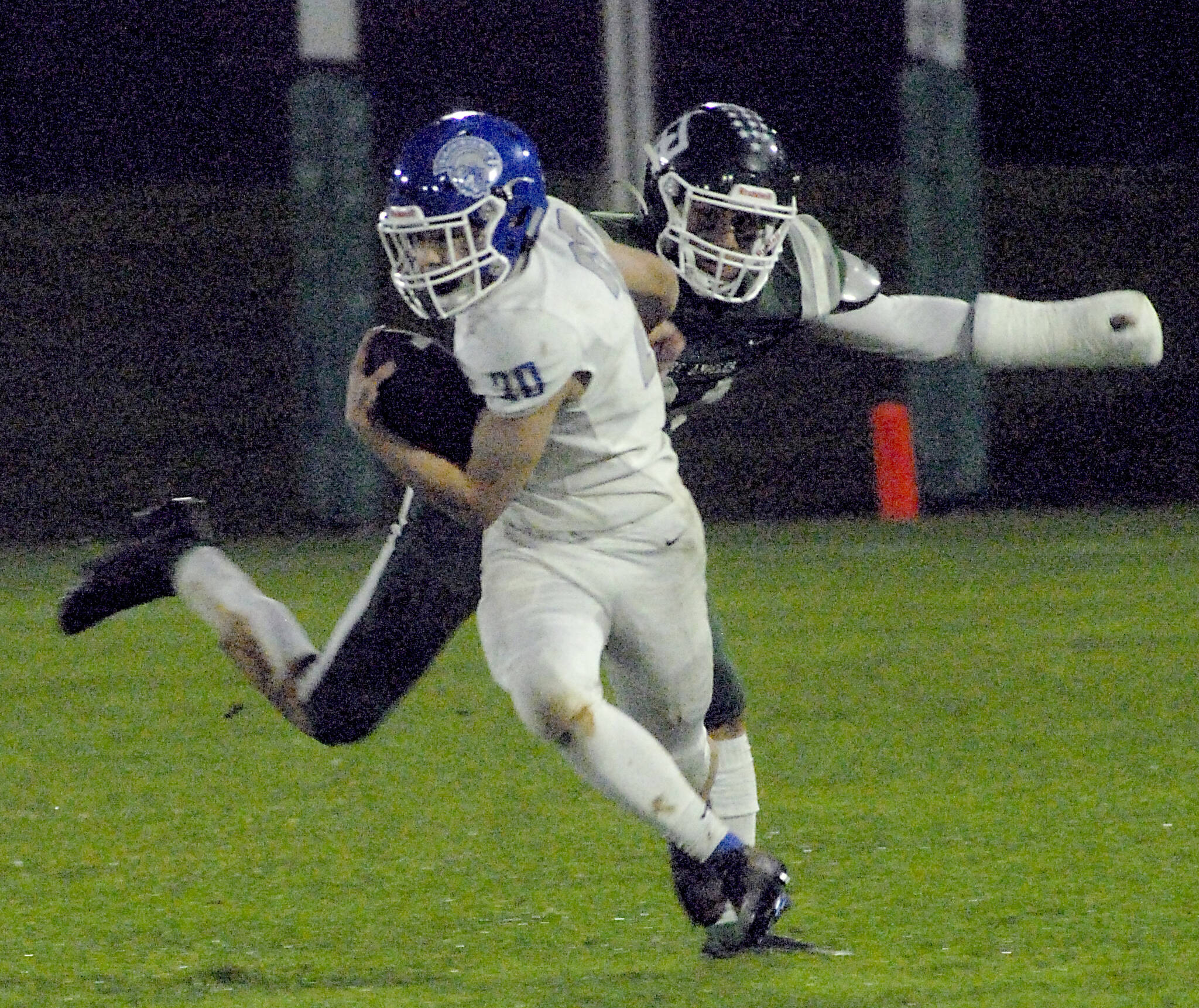 Olympics Joshua Gauyan evades the defense of Port Angeles Jeremiah Hall on Friday night in Port Angeles. (Keith Thorpe/Olympic Peninsula News Group)
