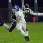 Olympics Joshua Gauyan evades the defense of Port Angeles Jeremiah Hall on Friday night in Port Angeles. (Keith Thorpe/Olympic Peninsula News Group)