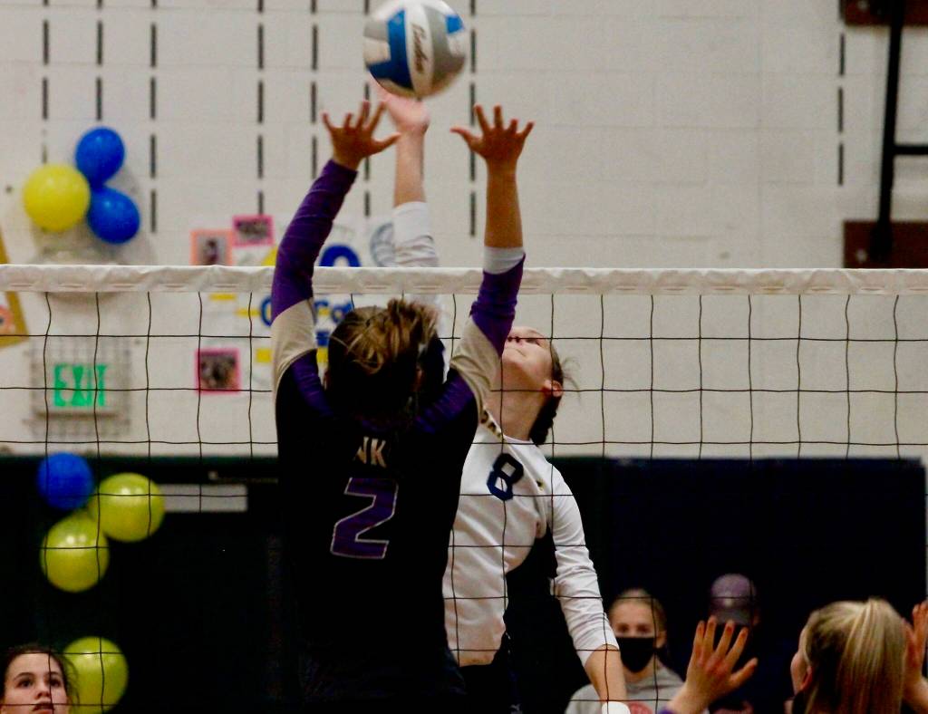 Allie Wildsmith uses every inch of her wingspan to reach up and knock a shot past a North Kitsap defender. (Mark Krulish/Kitsap News Group)