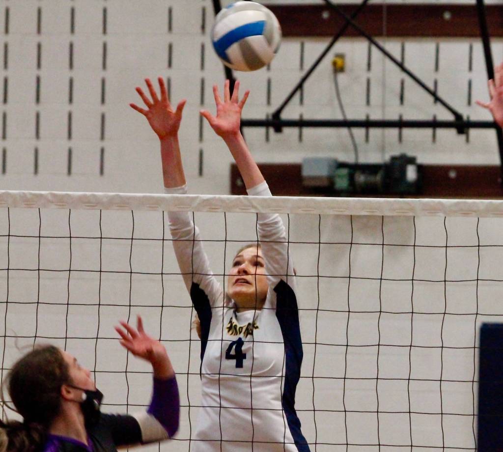 Rebecca Roman tries to get her fingers on a North Kitsap spike. (Mark Krulish/Kitsap News Group)
