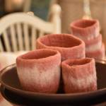 Felted bowls displayed in a wooden bowl at Sea Glass interior design showroom in Winslow.