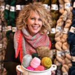 Sarah Dimond with a bowl full of artisan yarns is the co-owner of The Lamb & Kid, and a yarn hand-dyeing expert and knitting enthusiast.
