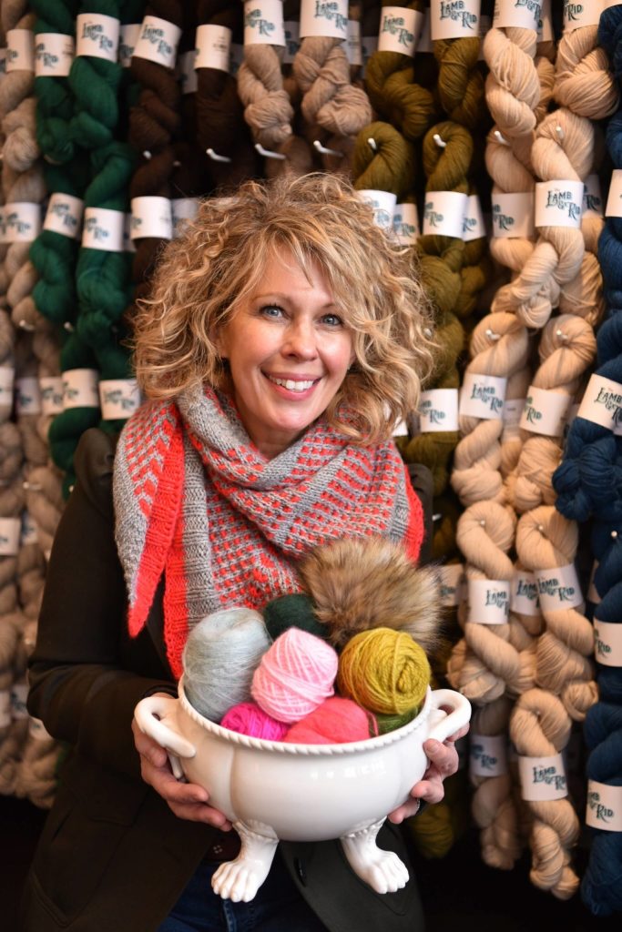 Sarah Dimond with a bowl full of artisan yarns is the co-owner of The Lamb & Kid, and a yarn hand-dyeing expert and knitting enthusiast.