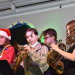 Three french horn players in the Bainbridge High School band.