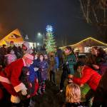 Santa poses with children after the Annual Tree Lighting held at Winslow Green.