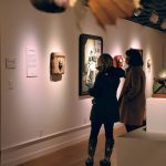 Two visitors viewing the Bygones art exhibition of paintings by Julie Read and assemblage by Steve Parmelee at the Bainbridge Arts and Crafts gallery at 151 Winslow Way E. Nancy Treder/Bainbridge Island Review photos