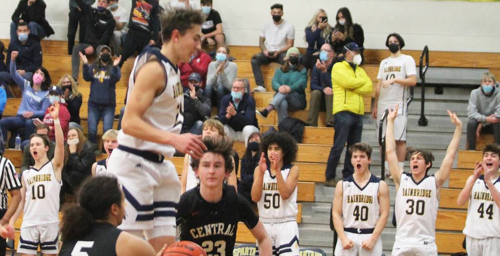 The BI bench cheers after a teammate blocks a shot.