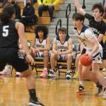 Cliff Hennessey (3) drives the baseline for BI and a second later did a nice step-around move to score.