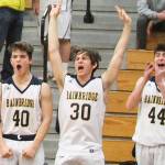 Spartans Harris Intihar (40), Cooper Benjamin (30) and Noah Davis (44) react after one of their teammates made a spectacular play.