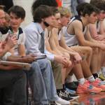 BI coaches and bench players watch the action against Central Kitsap.