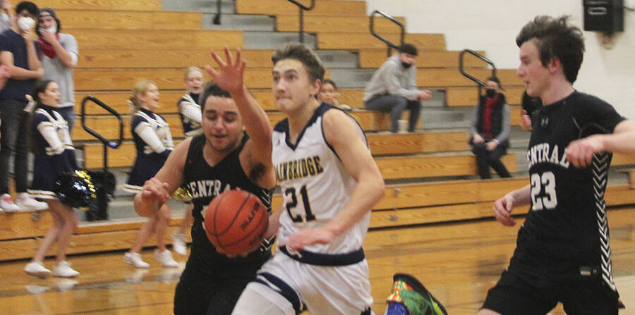 Everett Moore (21) drives to the basket on a fastbreak for the Spartans.