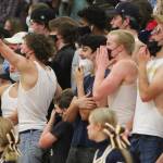 Fans in the BI student section react after the Spartans blocked a shot.