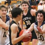 Everett Moore (21) and Henry Cartsen (20) apply pressure on the ball for the Spartans against Central Kitsap. Steve Powell/Bainbridge Review photographs