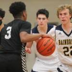 Braydon Morgan (22) of BI defends in the contest against CK.