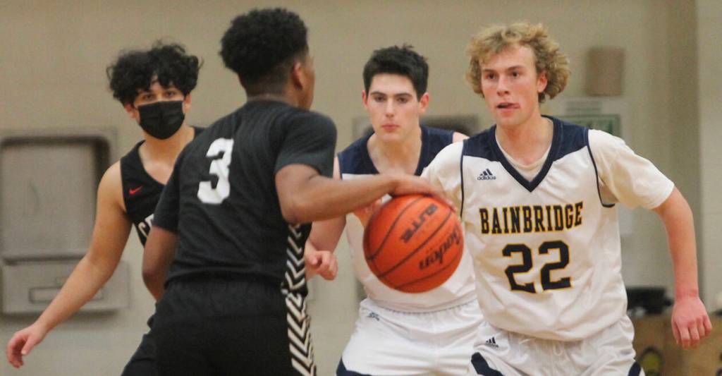 Braydon Morgan (22) of BI defends in the contest against CK.