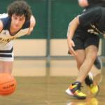 Spartan Henry Carsten (20) comes up with a steal against the Cougars.