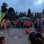 A large group gathers on Winslow Green in observance of the first night of Hanukkah. Photos courtesy of Rabbi Mendi Goldshmid.