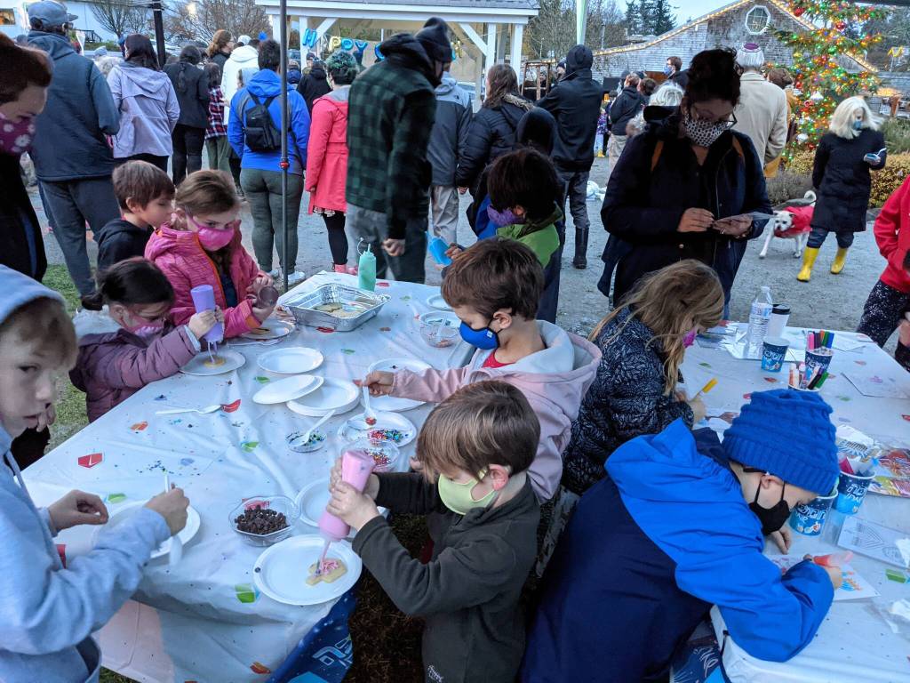 Children decorate cookies and make crafts during the Hanukkah celebration at Winslow Green.