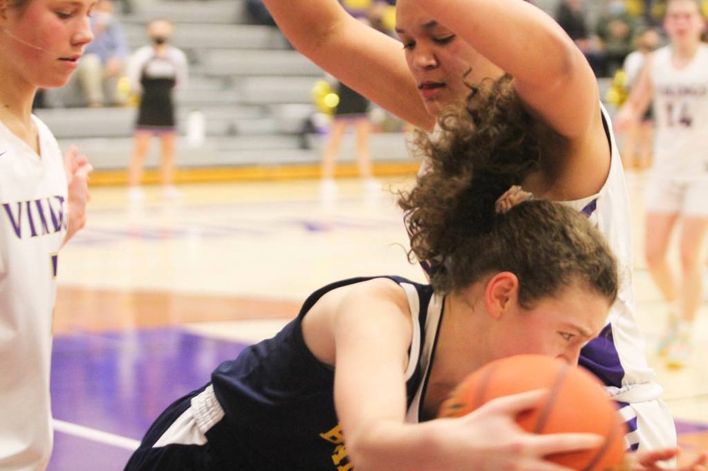 Grace Colburn dribbles the ball out of a tight situation in the game against NK.