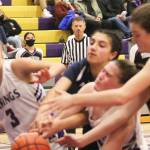 Vikings and Spartans collide trying to grab a loose ball. Steve Powell/Bainbridge Island Review photos