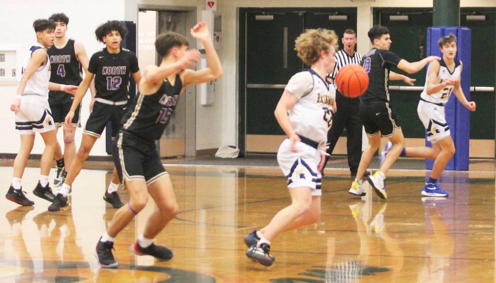 Brayden Morgan of BI takes off with the dribble against the Vikings.