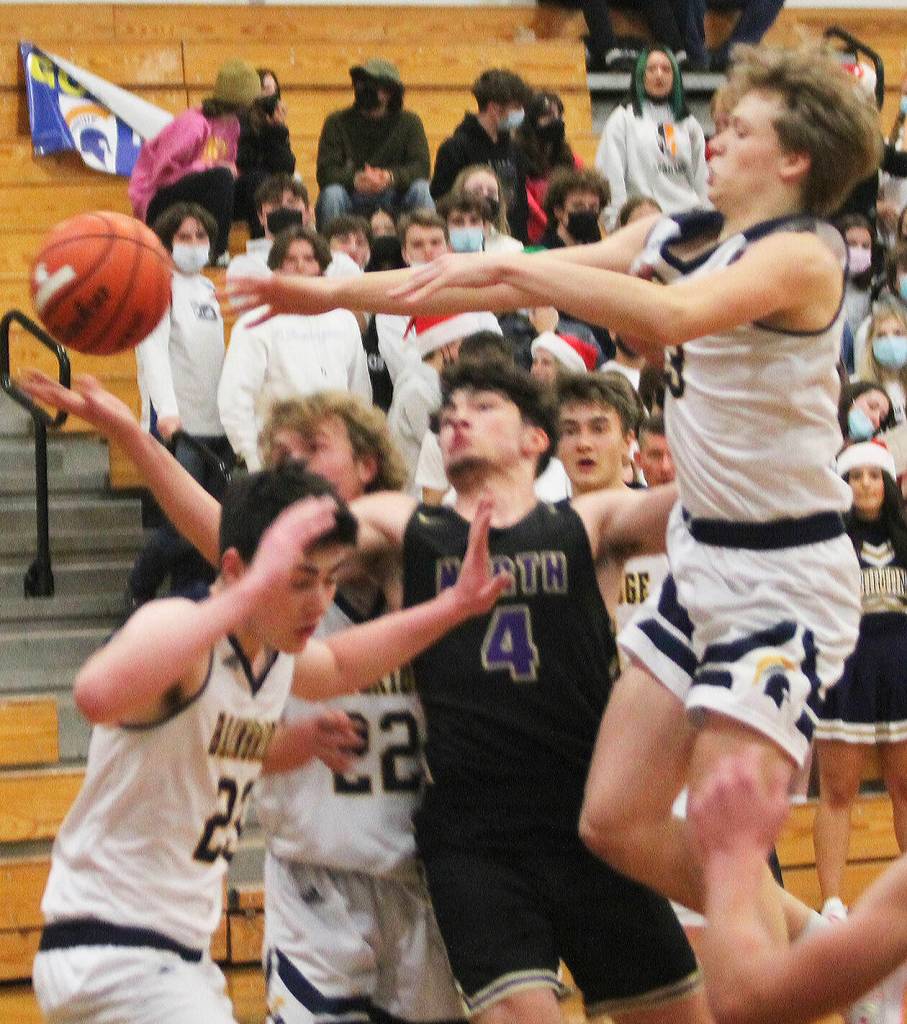 Jonas La Tour (4) of North Kitsap is surrounded by Spartans as he reaches for the ball.