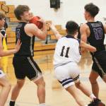 With Colton Bower (5) at the high post, Viking teammate Cade Orness (10) tries to rub off defender Breno Oguri (11) to get open as Johny Olmsted (0) looks on.