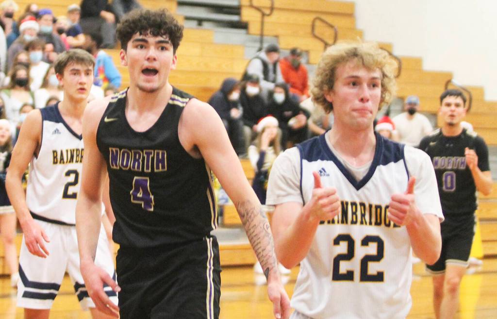 Brayden Morgan (22) of Bainbridge seems to agree with the call, while Jonas La Tour (4) of NK doesnt look too sure.