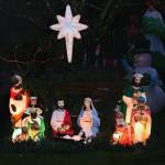 This antique nativity set with guiding star is West's favorite section of the light display, which has been drawing visitors to her house for more than half a century.