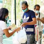Helping by handing out food in Manila.