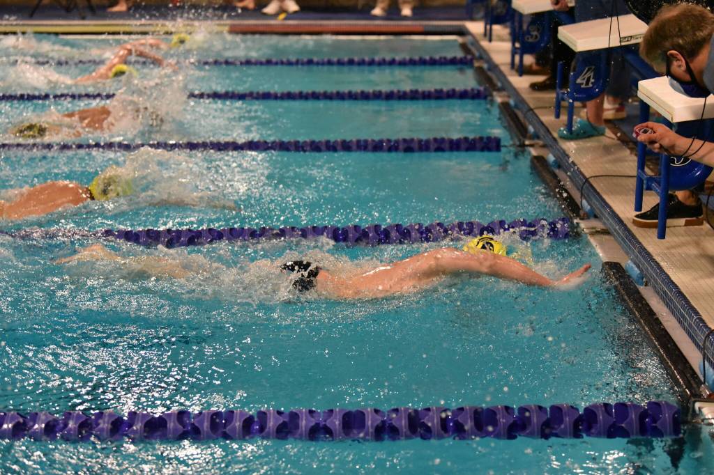 A BHS swimmer finishes almost one length ahead of the competition when BHS and NKHS met at the Aquatic Center.