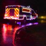 The Christmas firetruck makes its way around town.