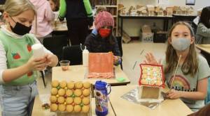 How many cookies does it take to roof a gingerbreadhouse? Last week, sixth-graders at Sakai Intermediate School enjoyed a sweet math lesson while solving geometry equations to answer the question, "If your roof is this size, and vanilla wafers are this size, how many will you need to cover the roof?" Courtesy photos