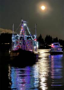 An impromptu holiday boat parade took place on Eagle Harbor off Bainbridge Island under a full moon Sunday night. The boats with Christmas lights lit up the waters. Washington State Ferries and the city of Seattle lit up at night added to the joy of the evening. Jonathan Davis Courtesy Photos