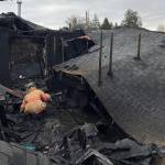 A firefighter checks through the damage. Courtesy photos