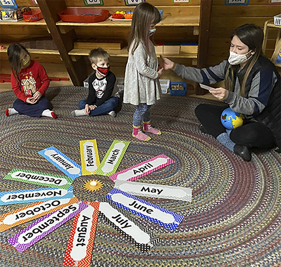Students sit in a cozy classroom and learn about the months of the year. Courtesy photo