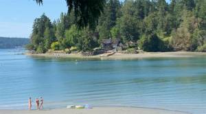 Beach lovers enjoy scenic Little Manzanita Bay. Courtesy Photos