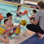 Coach Kristin Geller talks with the Junior Polo team.