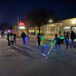 Kids turn light sticks into sabers at the event.