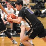 North Kitsaps Johny Olmsted (0) gets the Viking fastbreak started against Port Angeles last Thursday night. PA, however, was able to slow down NK to get the win. Keith Thorpe/For the Herald