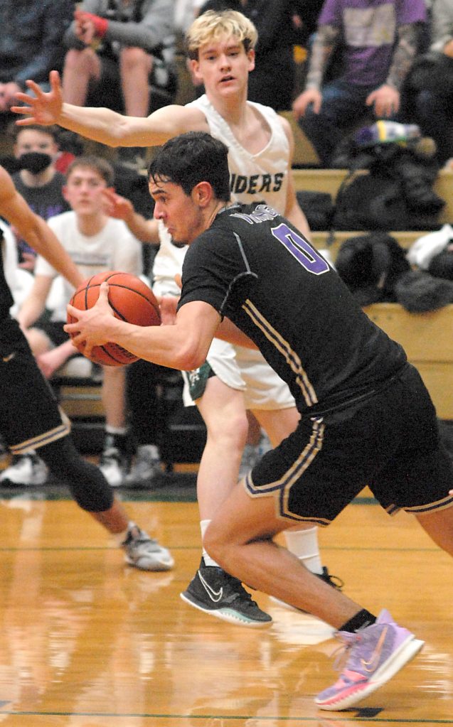North Kitsaps Johny Olmsted (0) gets the Viking fastbreak started against Port Angeles last Thursday night. PA, however, was able to slow down NK to get the win. Keith Thorpe/For the Herald