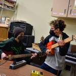 Nancy Treder/Bainbridge Island Review 
Sixth-grader Rowan Toler and fifth-grader George Wolffe make music with an electric guitar and cigar box banjo.