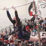 Steve Powell/Bainbridge Island Review photos 
Liz Olliffe performs on the bars for BHS at state.