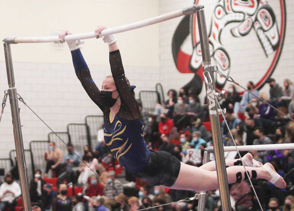 Steve Powell/Bainbridge Island Review photos 
Liz Olliffe performs on the bars for BHS at state.