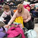 A mother and daughter wait in a refugee center in Poland. Courtesy Photo