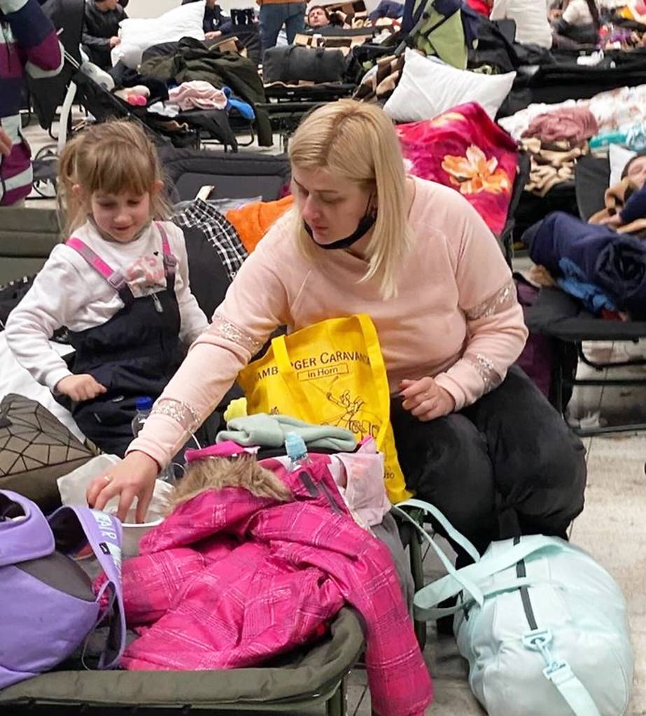 A mother and daughter wait in a refugee center in Poland. Courtesy Photo