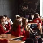 Left: Students in grade levels four through eight listen to a report from Jake Gillanders and ask questions about his trip.