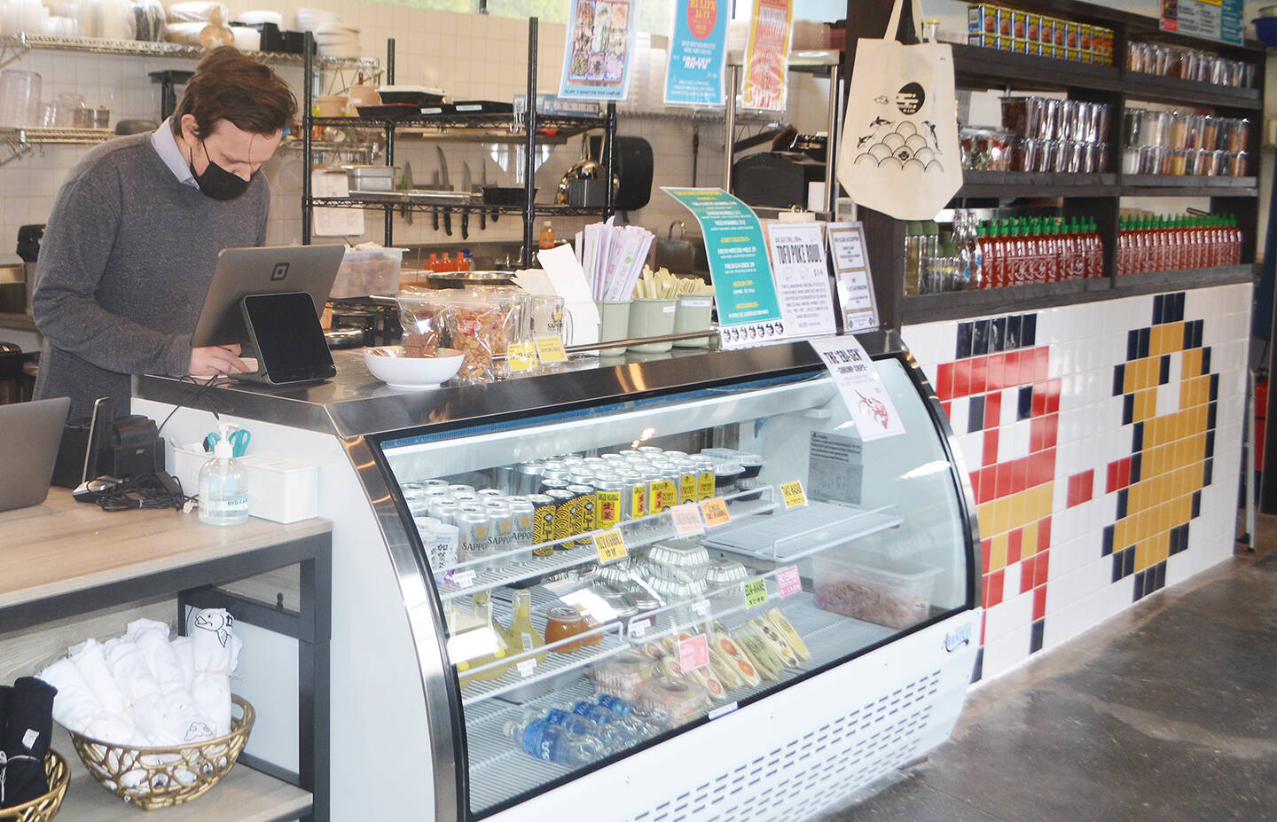 Customers can order food from the restaurant or the display case at the front counter.