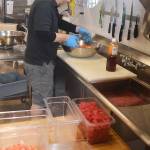 Josh Trebe mixes up a salmon dish in the kitchen. Steve Powell/Banbridge Review photos