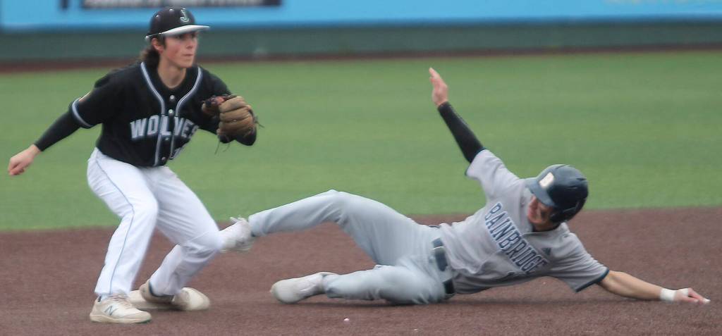Spartan leadoff hitter Kent Wisner steals second base against the Jackson Wolves.